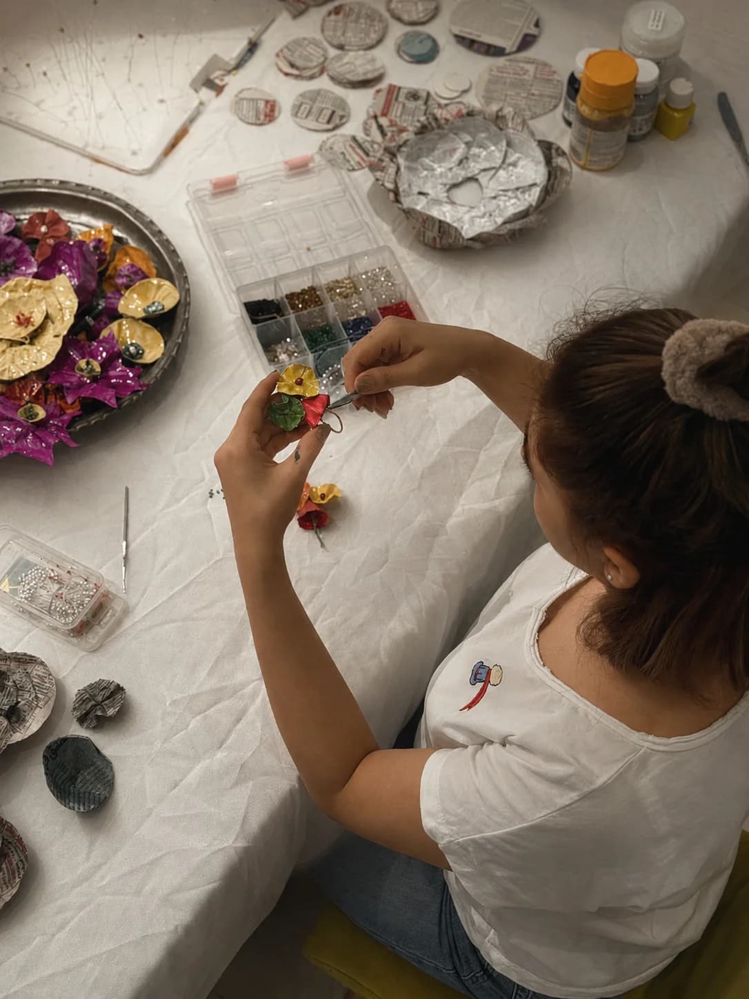 Recycled newspaper shaped by hand into sculptural form — Sara Idee wearable art process